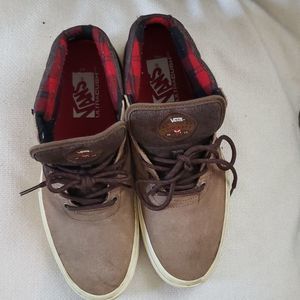 Vans skateboard ankle high suede and cloth sneakers.